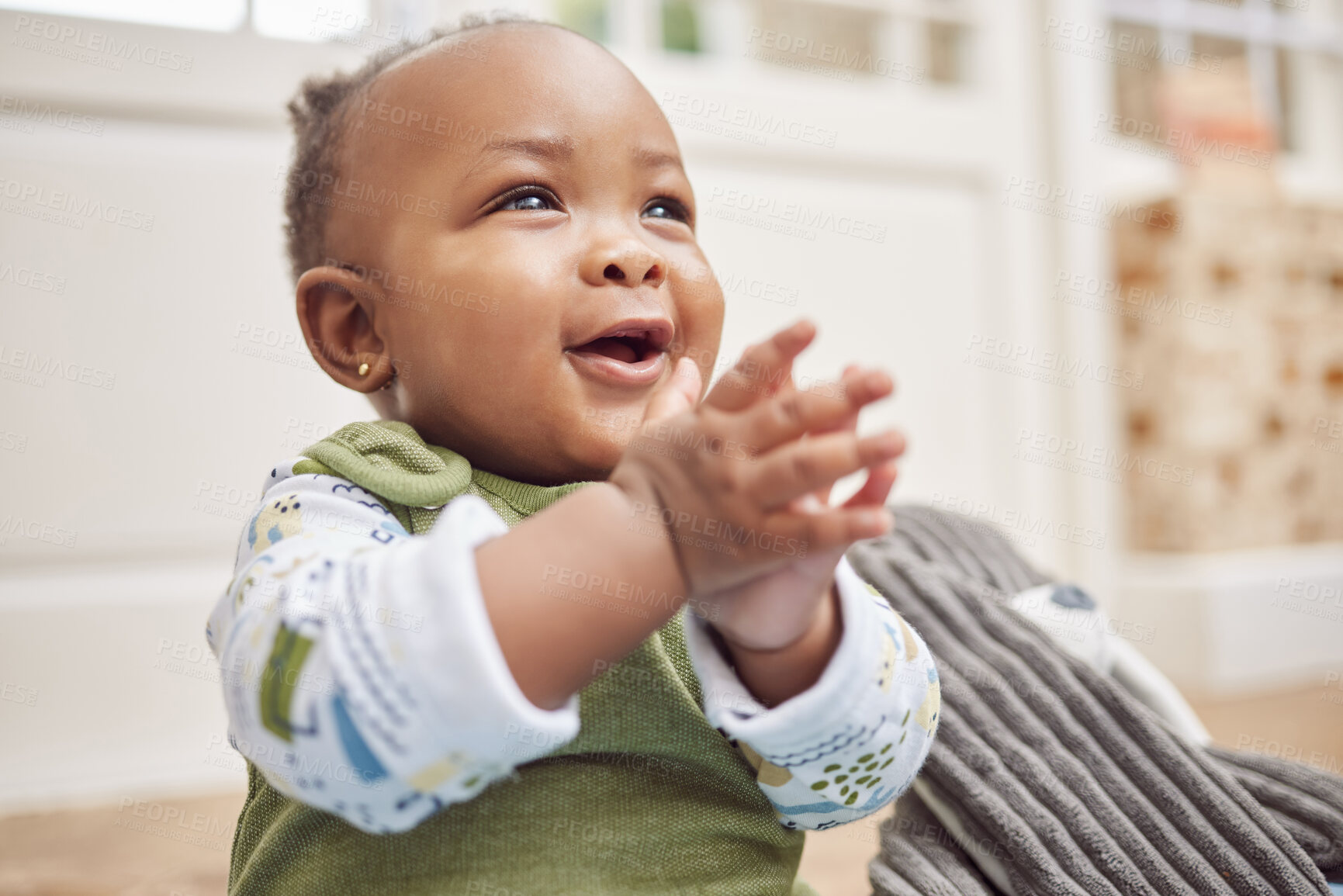 Buy stock photo Happy, baby and black child clapping in home, having fun or enjoying time alone. African newborn, children and toddler, kid and young infant play, smile or applause for childhood development in house