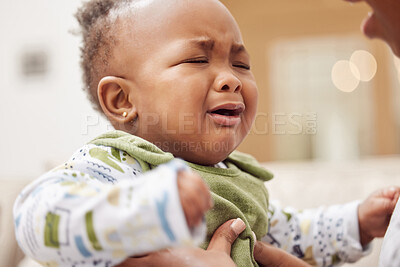 Buy stock photo Shot of a baby girl crying while sitting at home