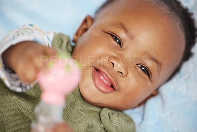 Buy stock photo Shot of an adorable baby boy lying down