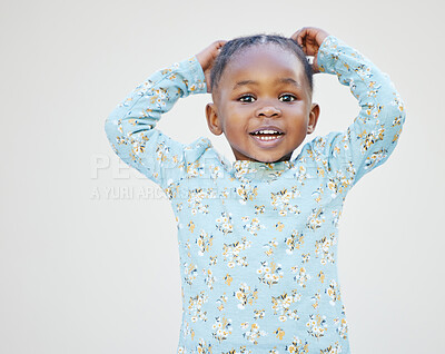 Buy stock photo Shot of an adorable little girl standing against a white background