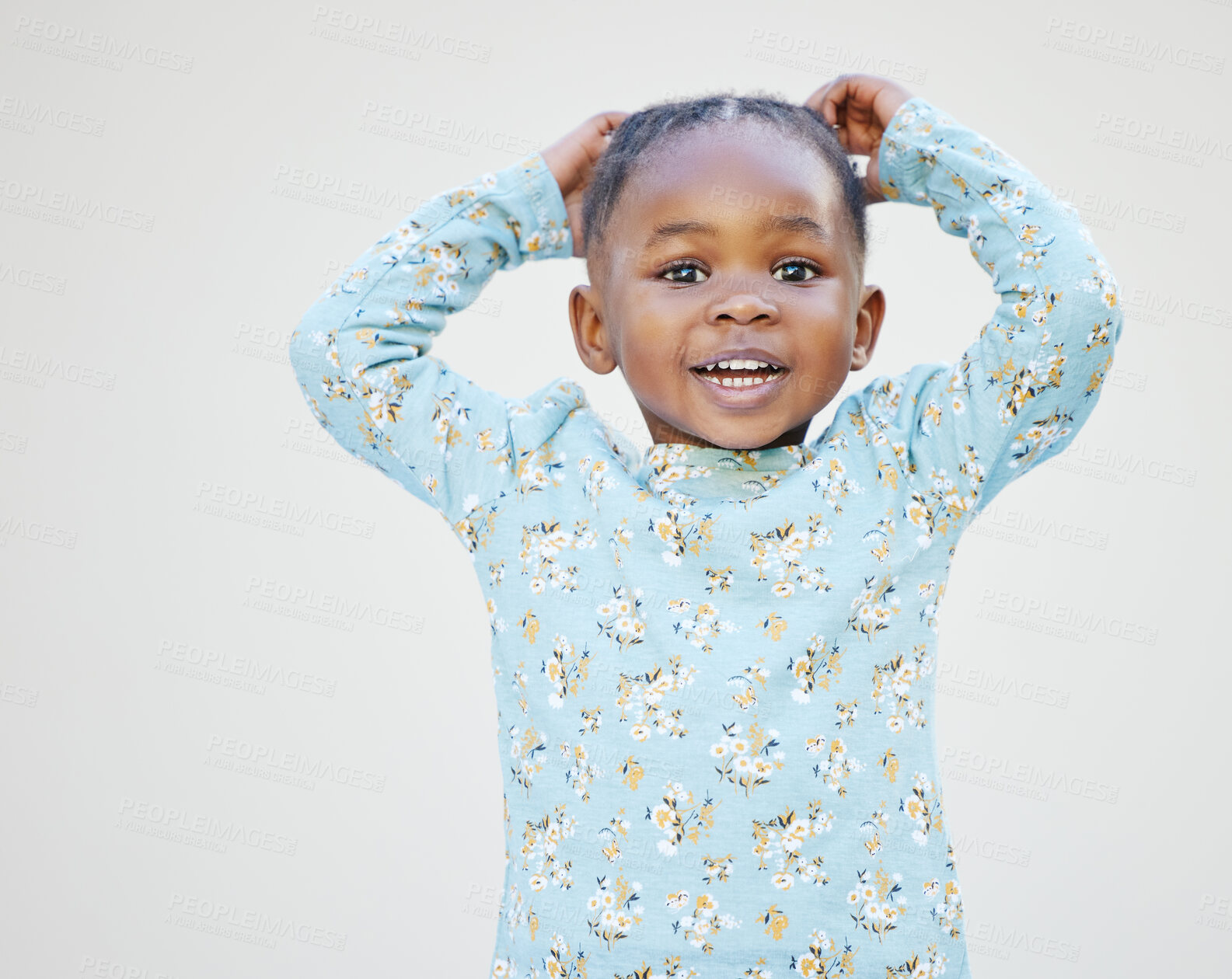 Buy stock photo Shot of an adorable little girl standing against a white background