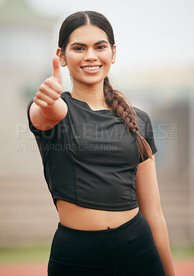 Buy stock photo Shot of an athletic young woman showing thumbs up