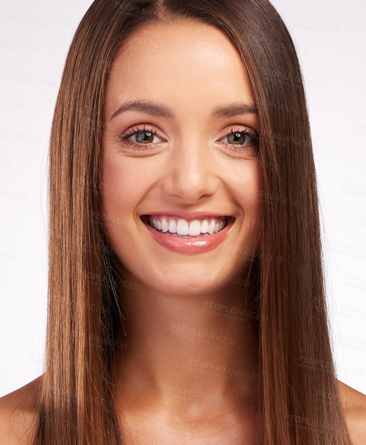 Buy stock photo Studio portrait of an attractive young woman posing against a grey background