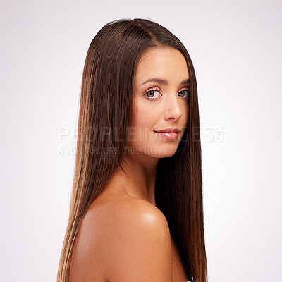 Buy stock photo Studio portrait of an attractive young woman posing against a grey background