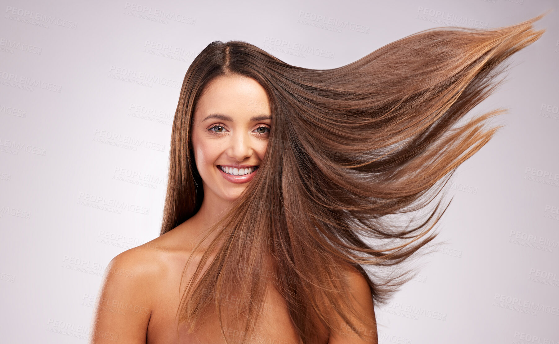 Buy stock photo Studio portrait of an attractive young woman posing against a grey background