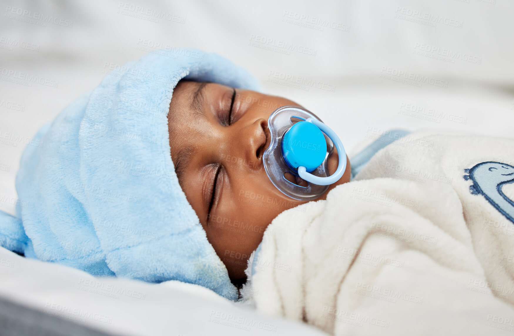 Buy stock photo Shot of a baby boy sleeping on a bed