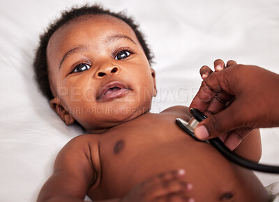 Buy stock photo Shot of a little baby at a checkup with a doctor at a clinic