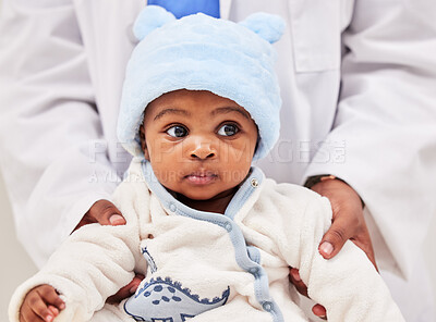 Buy stock photo African, little baby and health checkup with specialist or paediatrician with infant or healthcare clinic and medical wellness. Child patient, toddler and expert with kid in doctor's room or hospital