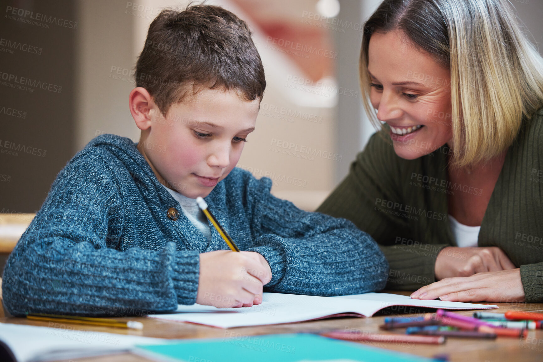 Buy stock photo Woman, kid and homework with paper on table for learning, knowledge and support in studying. Happy, family and mother with boy in house for child development, homeschool and pride in education of son