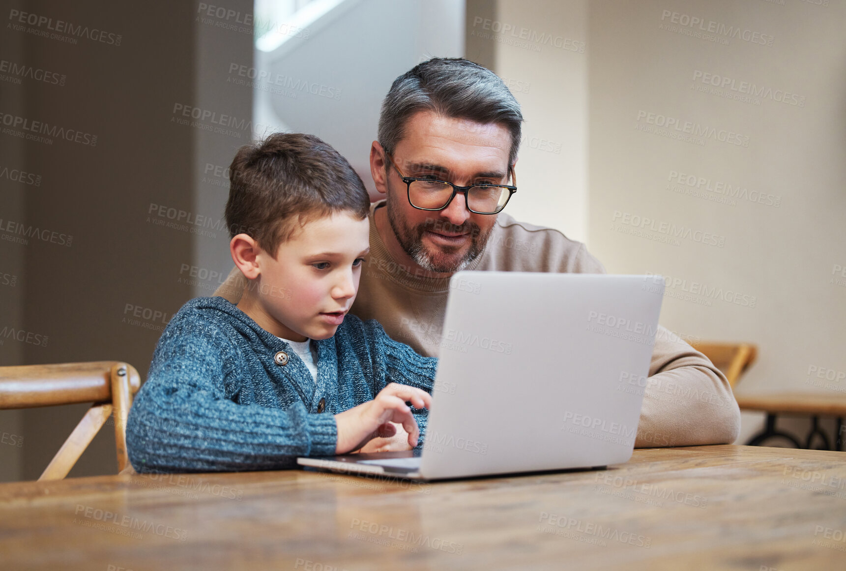 Buy stock photo Laptop, education and dad with child in home for online learning, school project and lesson. Family, student and father teaching boy on computer for help with studying, homework and assignment