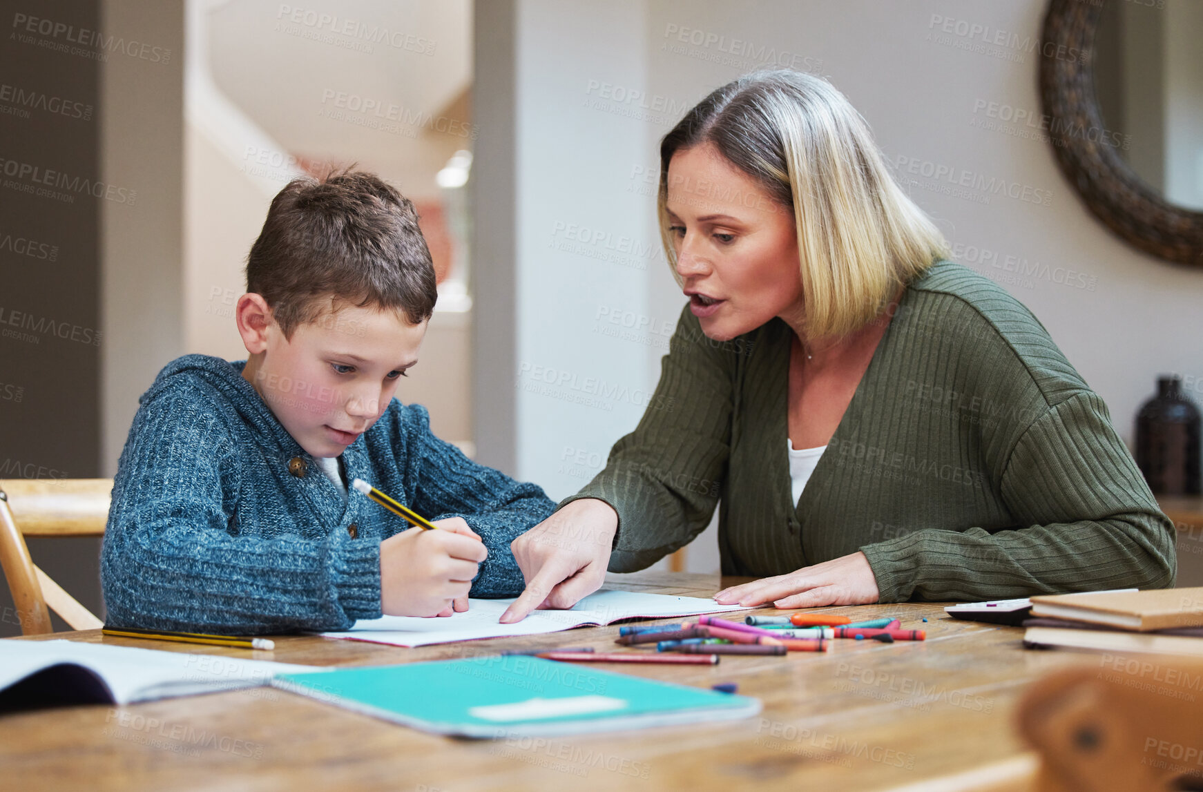 Buy stock photo Mother, kid and homework with paper on table for learning, knowledge and support in education. Family, writing and woman with boy in house for child development, homeschool and help with studying