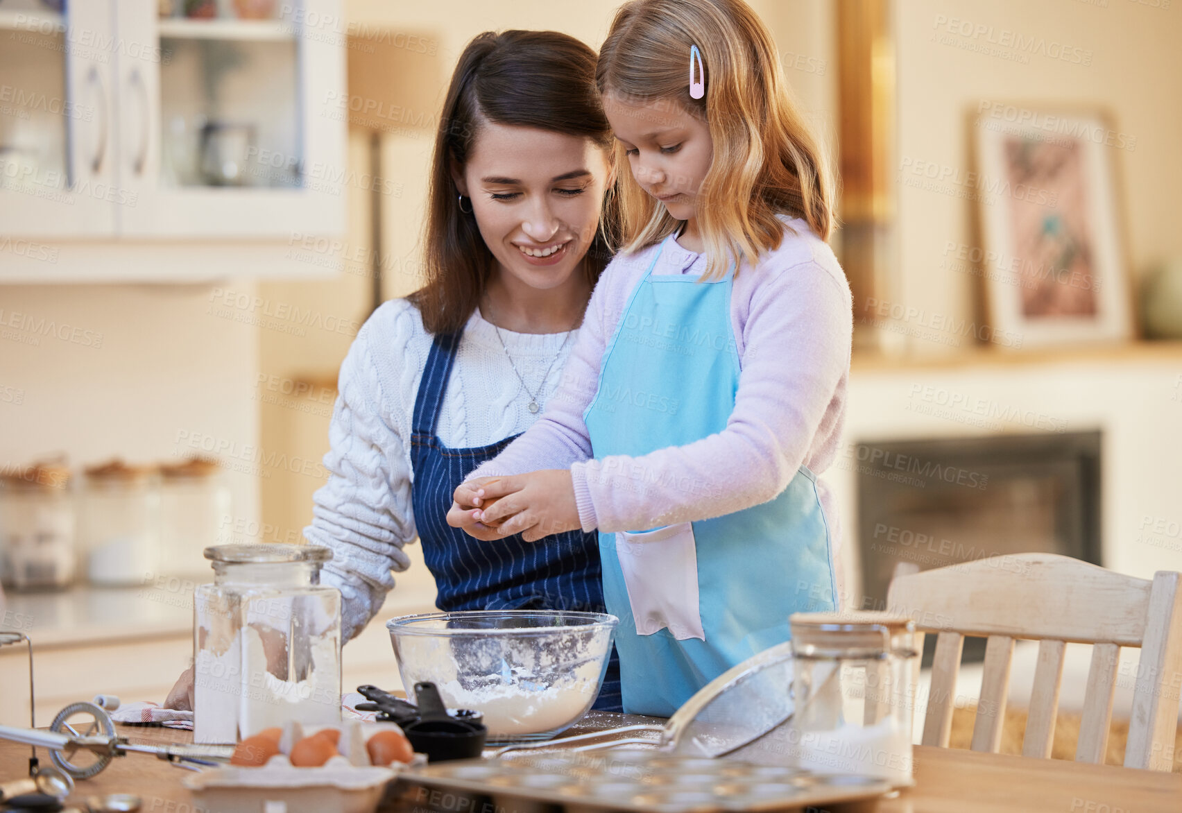 Buy stock photo Happy mother, daughter and baking with eggs or flour in kitchen for dessert, snack or mixing ingredients at home. Mom teaching junior baker, young child or little girl with bowl for learning mixture