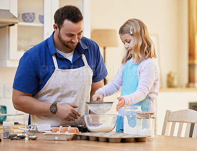 Buy stock photo Shot of a father helping his daughter sift flour into a bowl