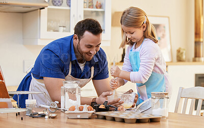 Buy stock photo Shot of a young man helping his daughter stir a bowl of cake batter