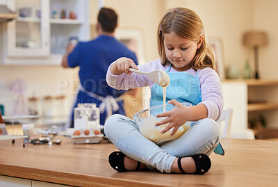 Buy stock photo Shot of a little girl stirring a bowl of cake batter