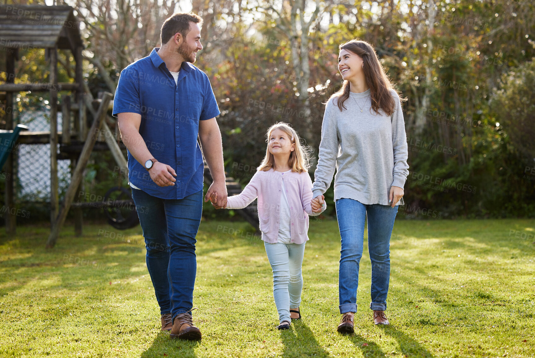 Buy stock photo Nature, walking and girl holding hands with parents in outdoor park for support, care or bonding together on weekend. Family, young kid and happy man with woman for love, child development or memory