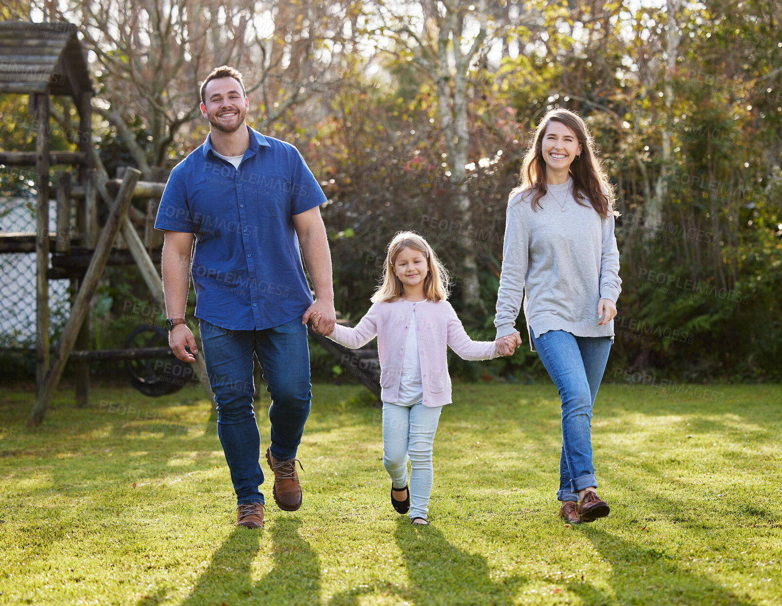 Buy stock photo Portrait, walking and girl holding hands with parents in outdoor park for support, family or bonding together on weekend. Nature, kid and happy man with woman for love, child development or memory