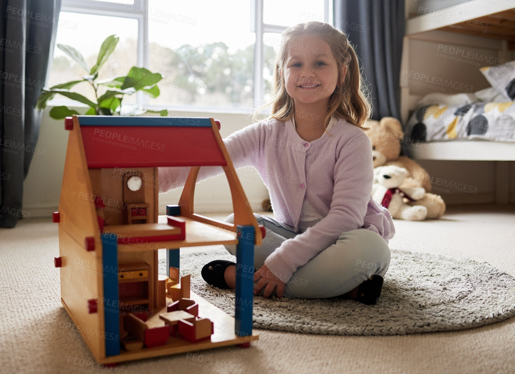 Buy stock photo Girl, toys or portrait in house for development or learning, child in home for motor skills. Young kid, bedroom or relax game with wood block for education or creativity, wellness or cognitive growth