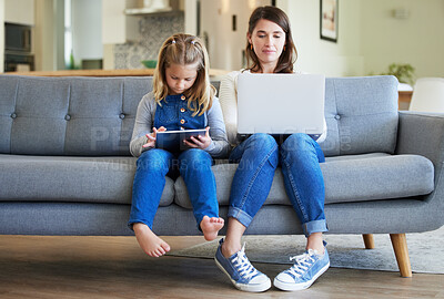 Buy stock photo Laptop, tablet and mom with girl child in home for streaming movies, film or series together on sofa. Family, single parent or girl child with mom on technology for remote work, games or freelance