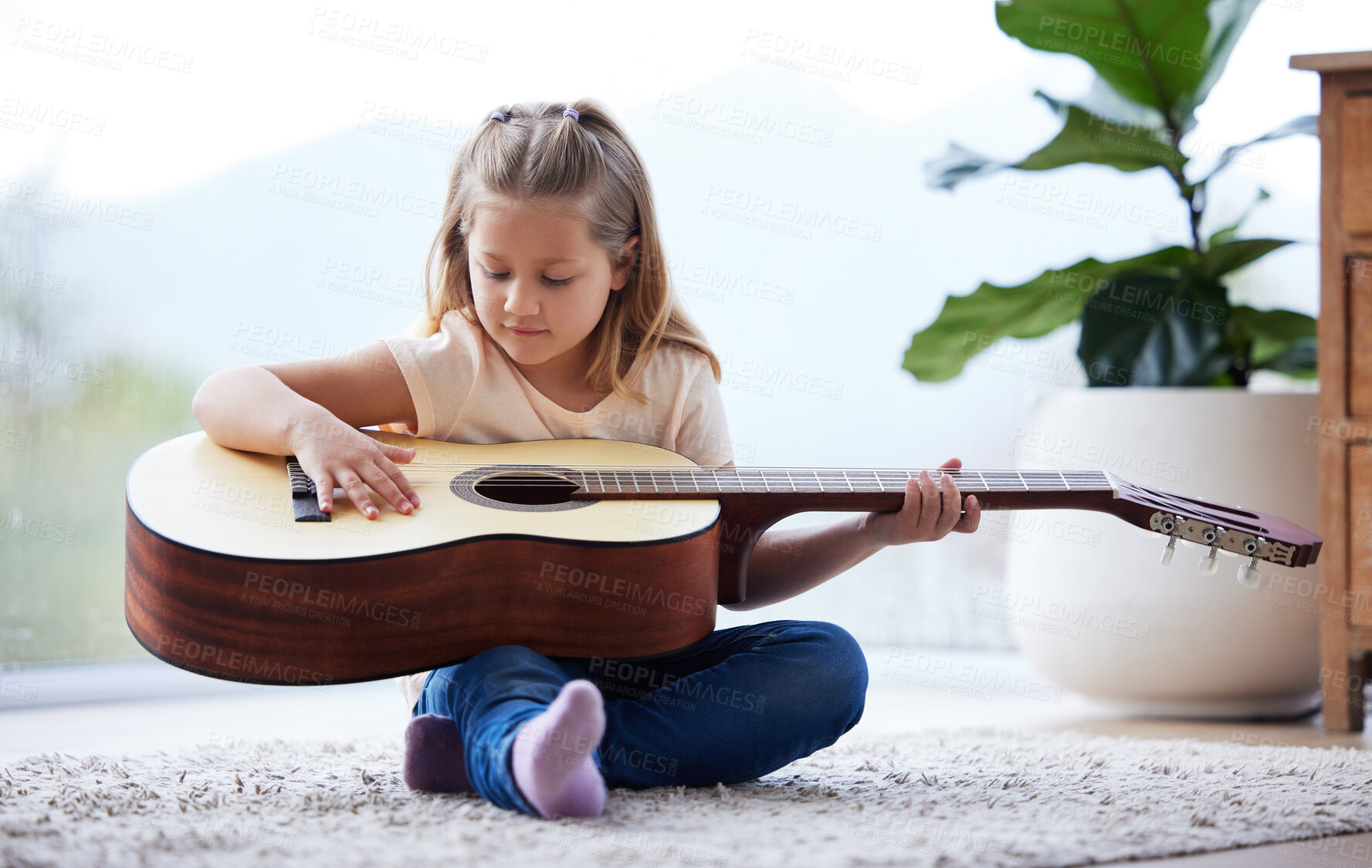 Buy stock photo Girl, child and guitar in home for learning, music and creativity or education in morning. Audio, kid and study or play in living room for development, knowledge and talent or practicing in lounge