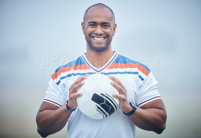 Buy stock photo Shot of a young soccer player holding the ball