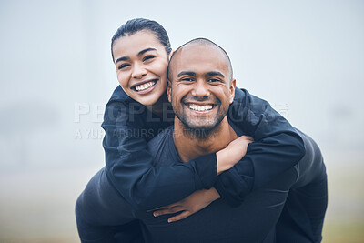Buy stock photo Shot of a young male athlete giving his girlfriend a piggyback ride