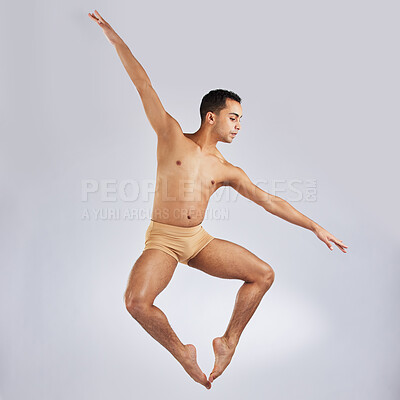 Buy stock photo Studio shot of a young man performing a ballet recital against a grey background