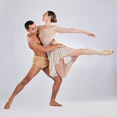 Buy stock photo Studio shot of a young man and woman performing a ballet recital against a grey background