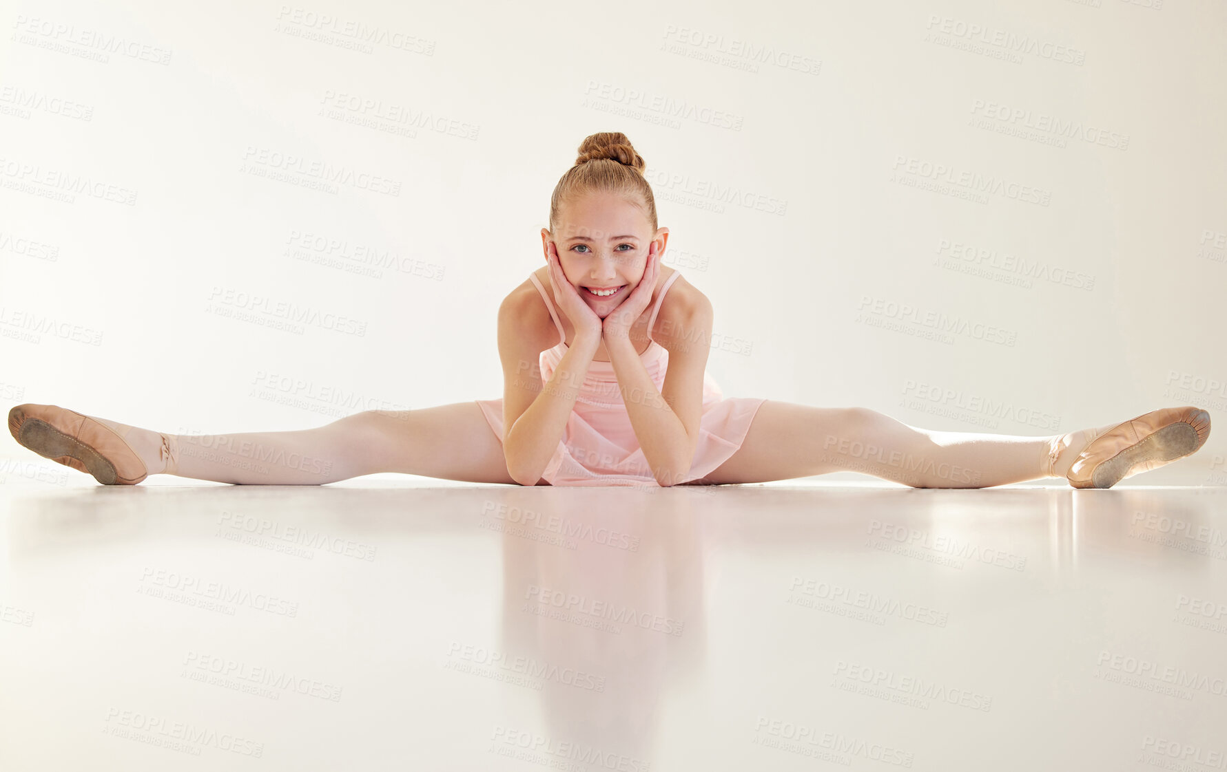 Buy stock photo Shot of a young ballerina stretching in a dance studio