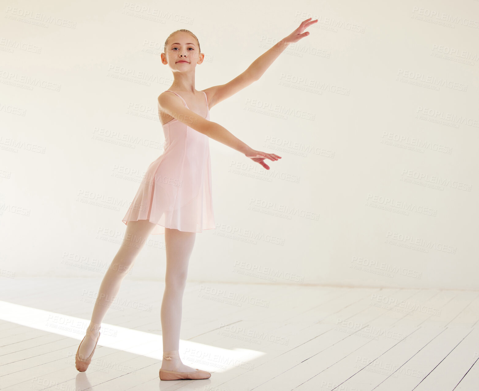 Buy stock photo Shot of a young ballerina dancing in a studio