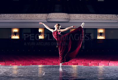 Buy stock photo Shot of a ballerina performing her routine in a theater