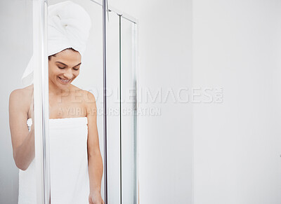 Buy stock photo Shot of a young woman getting out of a shower