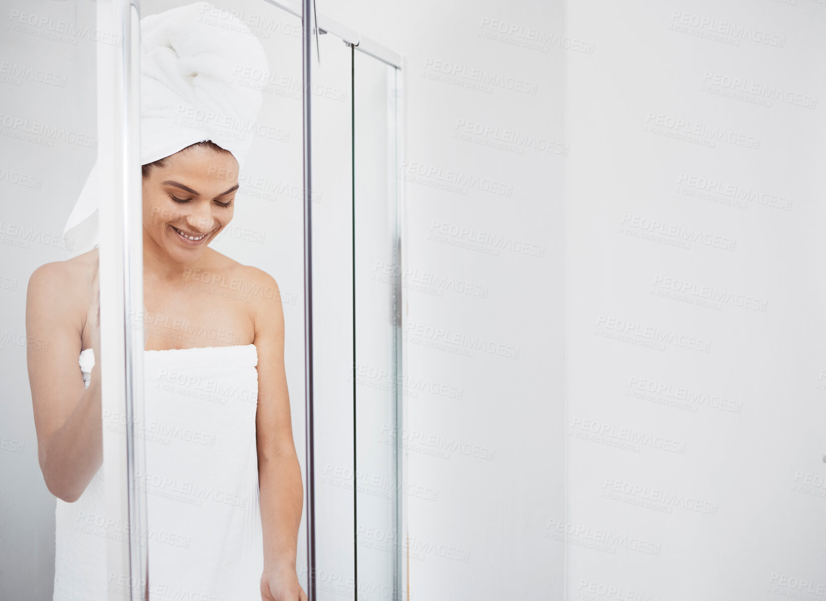 Buy stock photo Shot of a young woman getting out of a shower