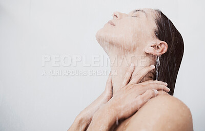 Buy stock photo Shot of a young woman rinsing her hair during a shower