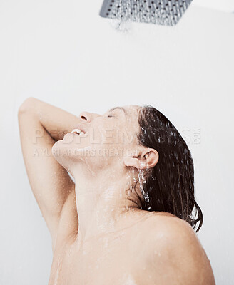 Buy stock photo Shot of a young woman rinsing her hair during a shower
