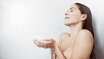 Buy stock photo Shot of a young woman taking a shower at home