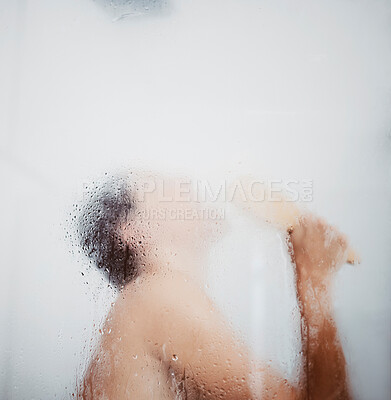 Buy stock photo Shot of a young woman having fun singing while in the shower