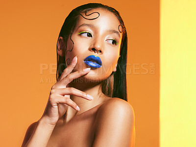 Buy stock photo Cosmetics, blue lipstick and face of woman in studio for makeup, eye shadow and beauty salon. Creative aesthetic, cosmetology and female person with neon color for glamour, luxury style and glow