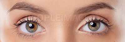 Buy stock photo Closeup shot of a young woman’s eyes against a grey background
