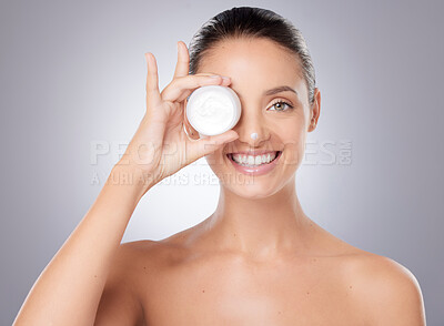 Buy stock photo Shot of a young beautiful woman posing against a grey background