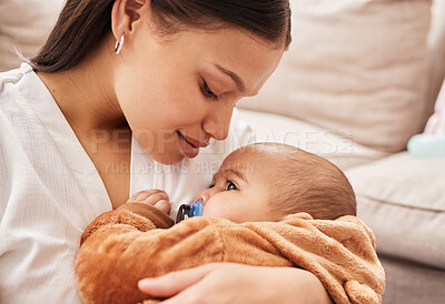 Buy stock photo Shot of a mother cuddling her son