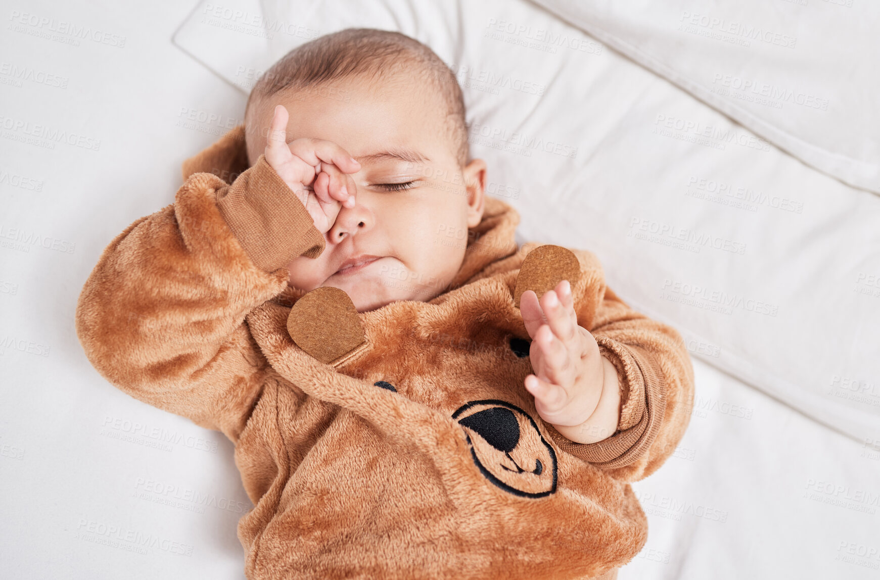 Buy stock photo Above, happy baby and sleepy in nursery for growth, development and family home as toddler, youth or child. Adorable kid, infant and tired on bed for support, love or wellness with health or nurture