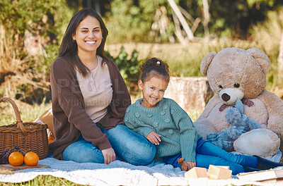 Buy stock photo Shot of a mother and daughter enjoy a picnic together
