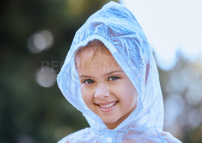 Buy stock photo Shot of a little girl playing in the rain
