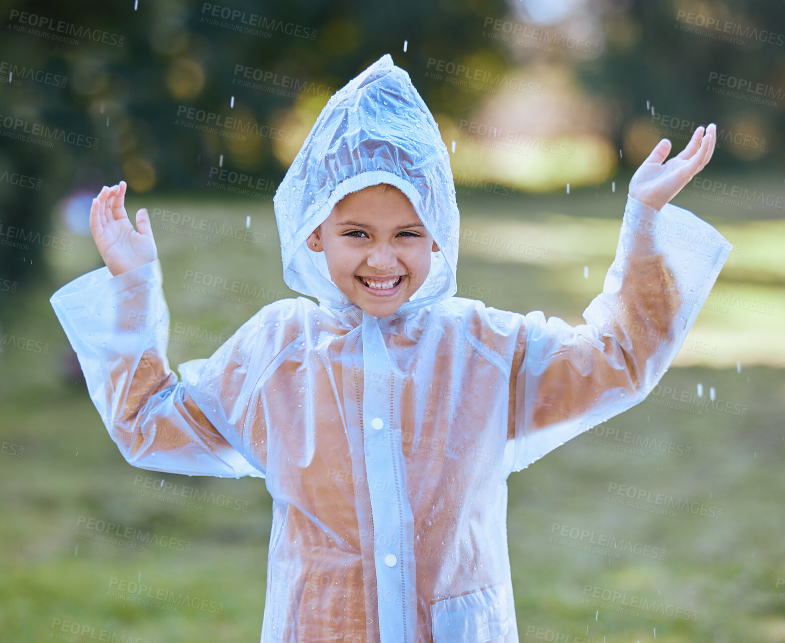 Buy stock photo Shot of a little girl playing in the rain