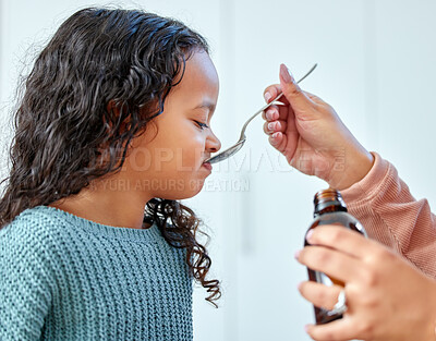 Buy stock photo Girl, mother and drinking medicine in home for flu or cold, sick child and cough syrup for health. Mommy, daughter and antibiotics for treatment or liquid vitamin, supplement and support for recovery