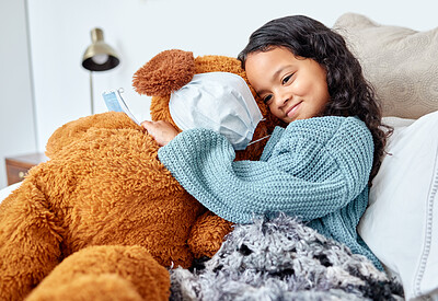 Buy stock photo Shot of a little girl cuddling her teddy in bed at home
