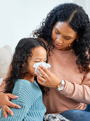 Buy stock photo Girl child, mom and sick in home with tissue for healthcare, risk of flu infection or FLiRT Covid. Female kid, parent or house for virus with paper for bacteria, care for allergy or cold in apartment