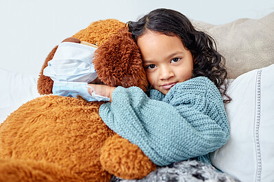Buy stock photo Shot of a little girl cuddling her teddy in bed at home