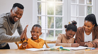 Buy stock photo Shot of a young family doing homework together at home